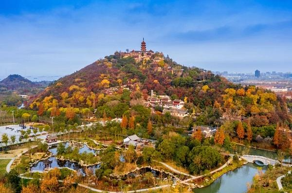 Langshan Scenic Area with temples and green hills in Nantong, China.