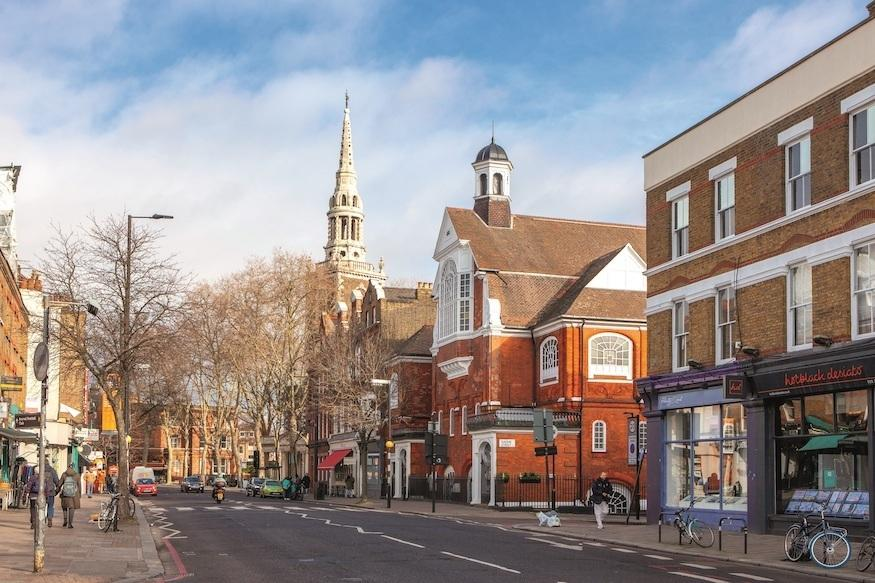 Upper Street in Islington London with shops and restaurants.