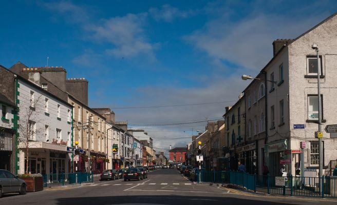 Pedestrian street with historic buildings and shops in Athlone, Ireland