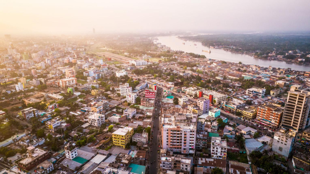 A panoramic aerial view of Khulna showing the cityscape, rivers, and surrounding green landscapes in Bangladesh.