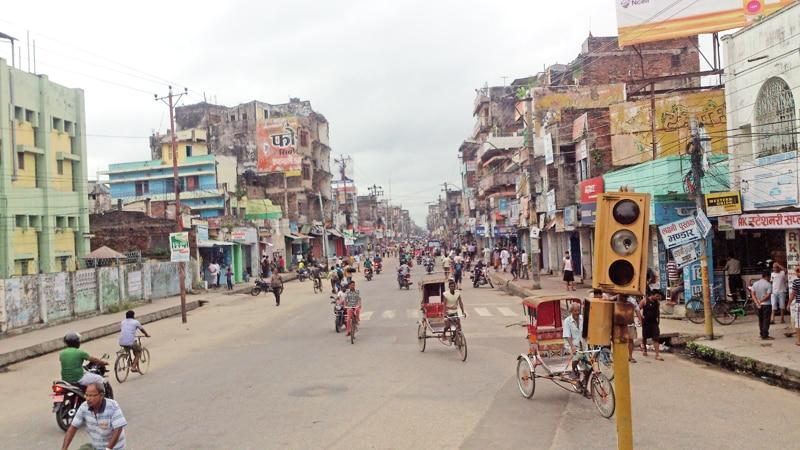Visitors walking through streets in Birgunj with local markets, shops, and pedestrian activity.