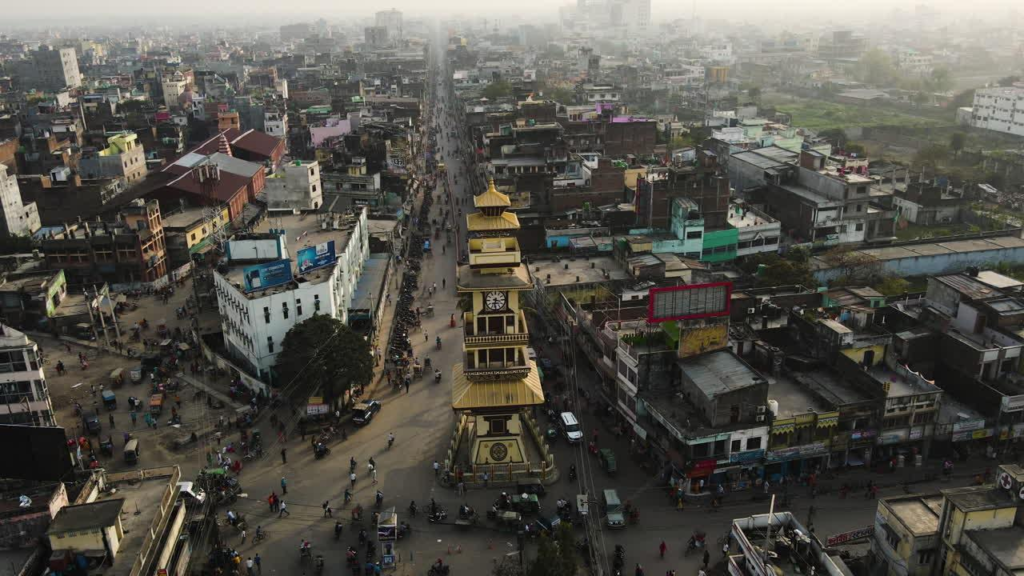Visitors exploring the Ghantaghar Clock Tower in Birgunj, Nepal, a historic city landmark.