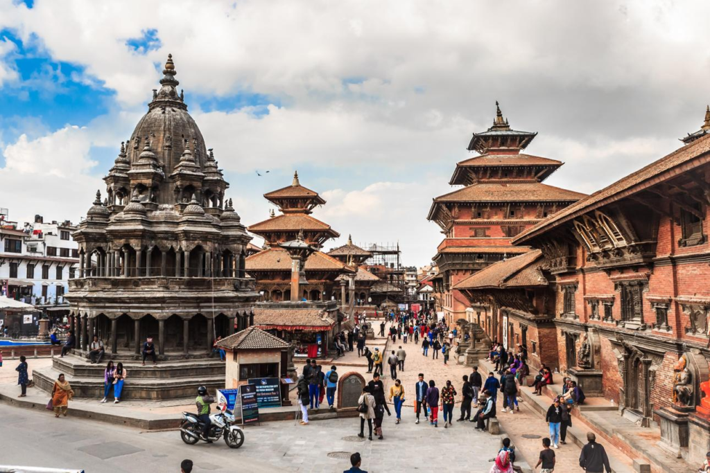 Visitors exploring Kathmandu Durbar Square, surrounded by historic temples and palaces.