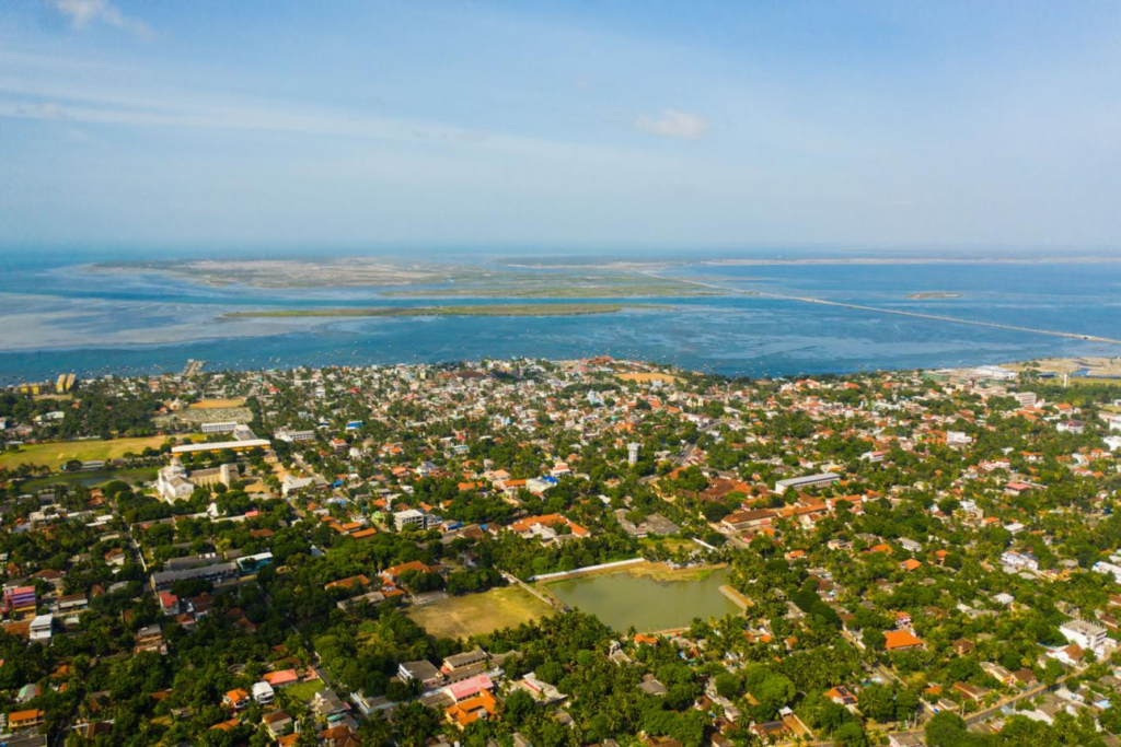 A panoramic aerial view of Jaffna showing the cityscape, coastline, and surrounding urban areas in Northern Province, Sri Lanka.