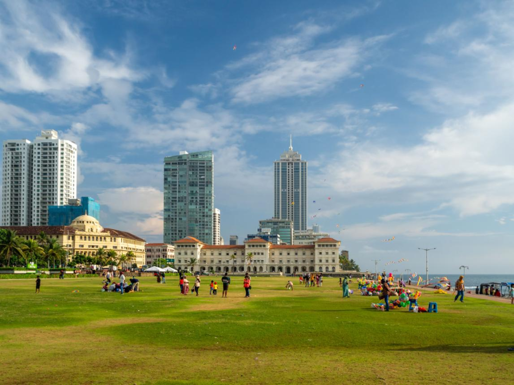 Visitors enjoying the Galle Face Green coastal promenade in Colombo, Sri Lanka, with ocean views and recreational space.
