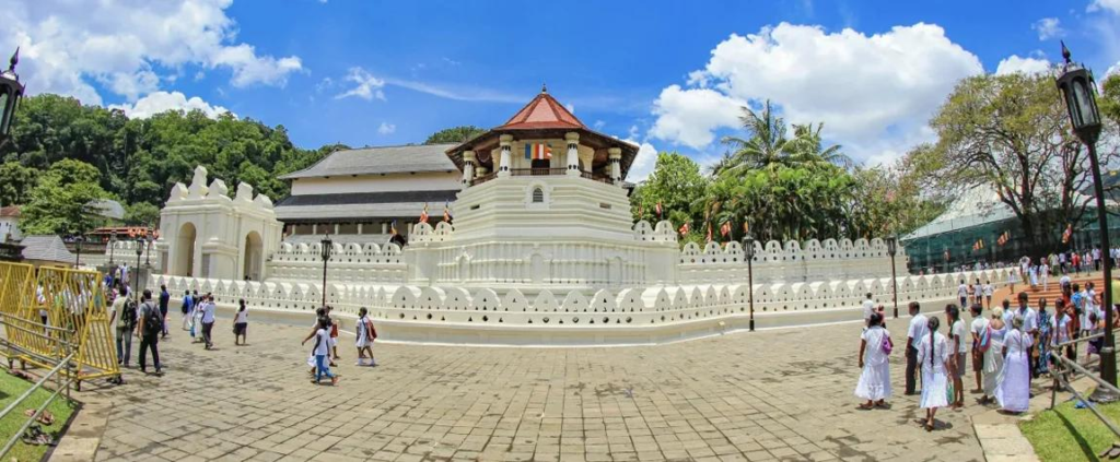 Visitors exploring the Temple of the Tooth in Kandy, a historic Buddhist temple and UNESCO World Heritage site.