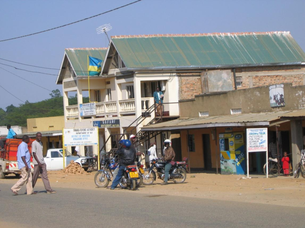 Visitors walking through streets in Nyagatare with local markets, shops, and pedestrian activity.