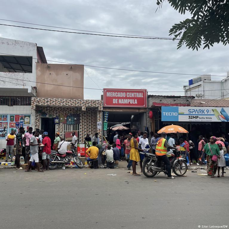 Visitors browsing fresh produce, spices, and local goods inside the bustling Central Market in Nampula.