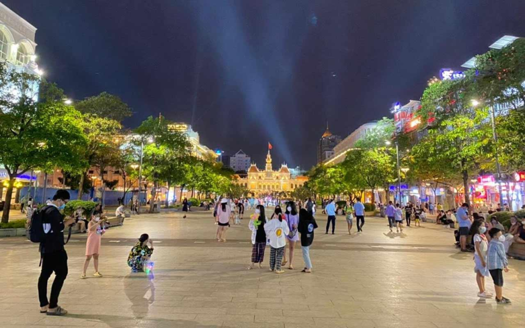 Nguyen Hue Walking Street with lights and pedestrians in Ho Chi Minh City.