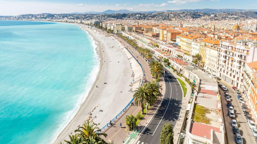 People walking along the Promenade des Anglais in Nice, France.