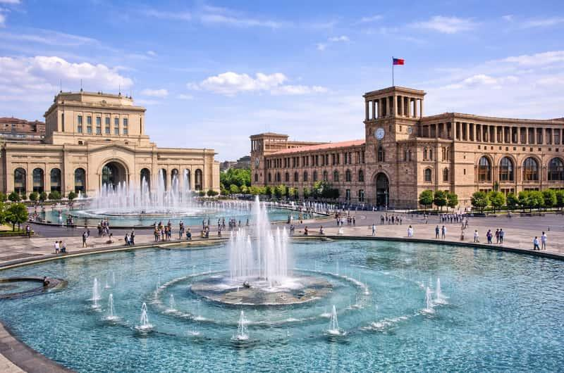 Republic Square in central Yerevan, Armenia, illuminated at dusk.