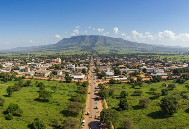 A panoramic aerial view of Morogoro showing the cityscape with the Uluguru Mountains in the background, Tanzania.