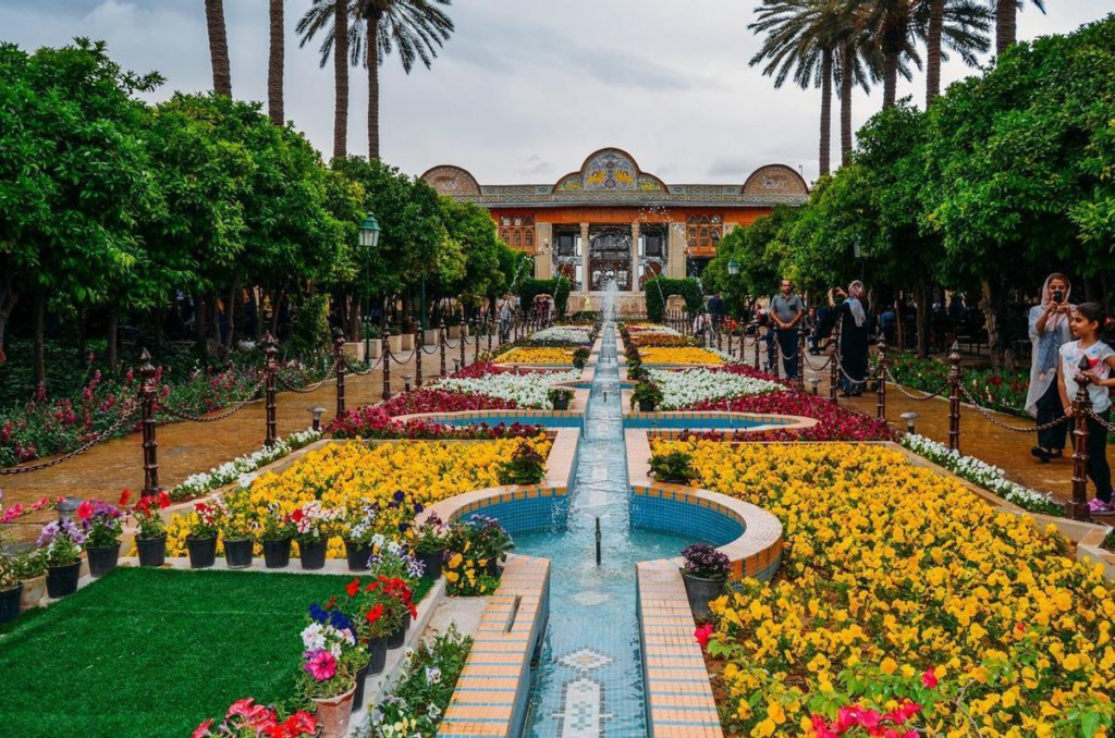 Historic Eram Garden in Shiraz with lush landscaping and a traditional Persian pavilion.