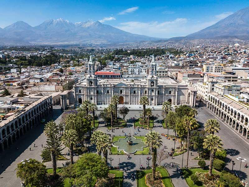 Historic Plaza de Armas in Arequipa, Peru with colonial buildings.