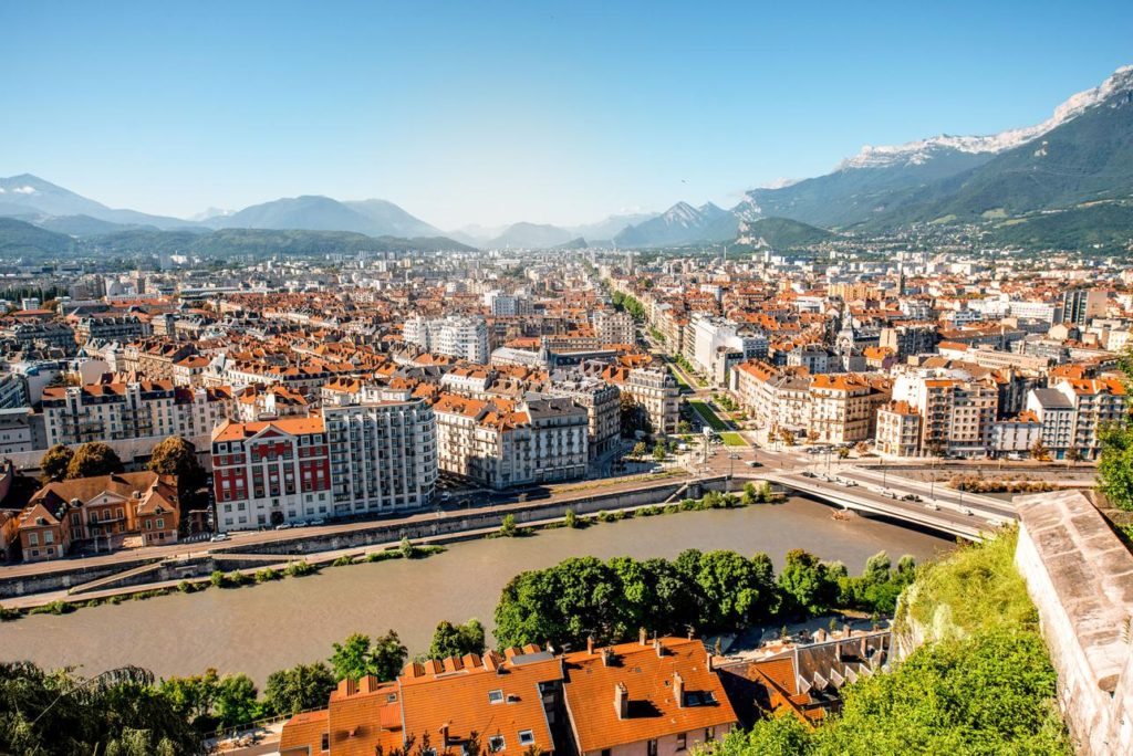 Grenoble city surrounded by the French Alps in France.