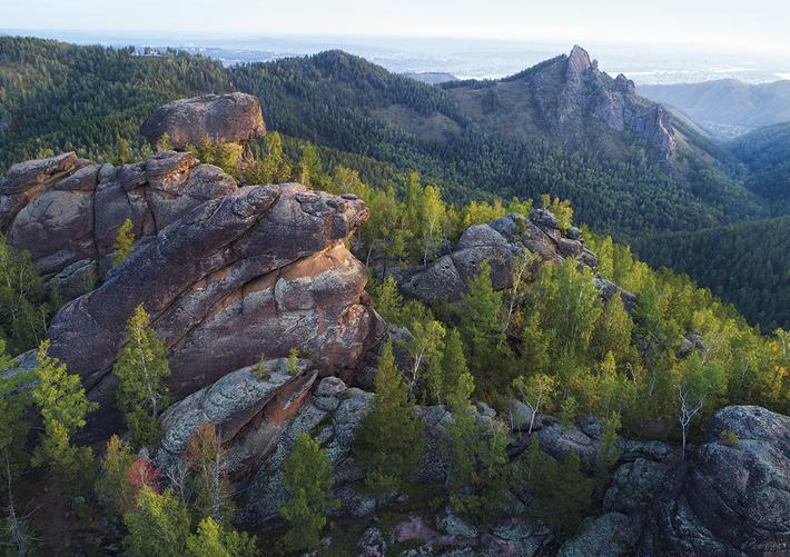 Rock formations and forest landscape at Stolby Nature Reserve near Krasnoyarsk, Russia.