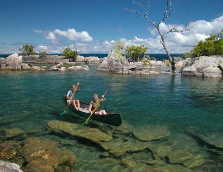 : Visitors enjoying the natural scenery and recreational activities along Lake Niassa near Lichinga, Mozambique.