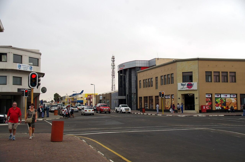 Visitors walking through streets in Walvis Bay with local markets, shops, and pedestrian activity.