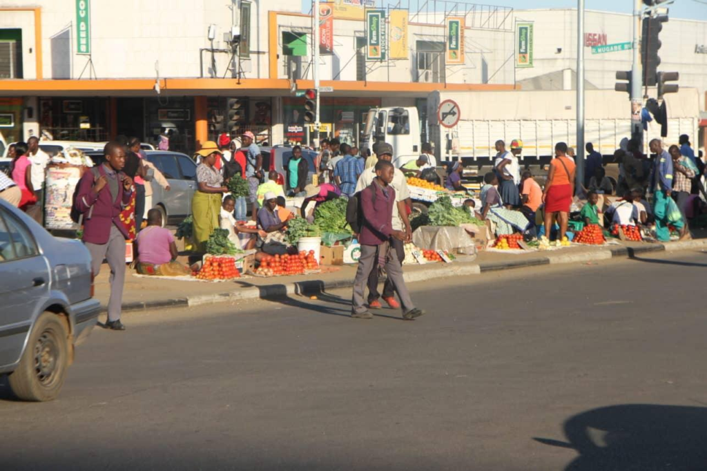 Visitors walking through streets in Gweru with local shops, markets, and pedestrian activity.