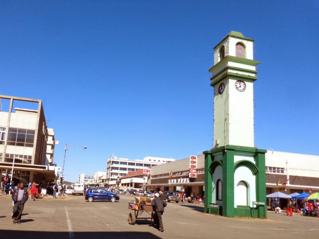 Visitors walking through streets in Gweru with local shops, markets, and pedestrian activity.