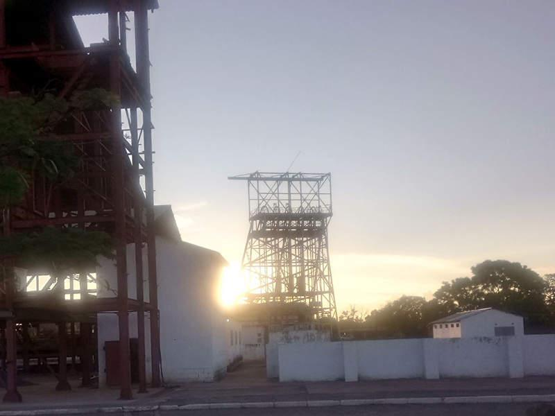 Visitors exploring historical mining sites near Kabwe, Zambia, showcasing industrial heritage and landscapes.
