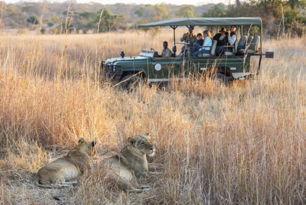 Visitors exploring Kafue National Park near Kafue, Zambia, with wildlife and natural scenery.
