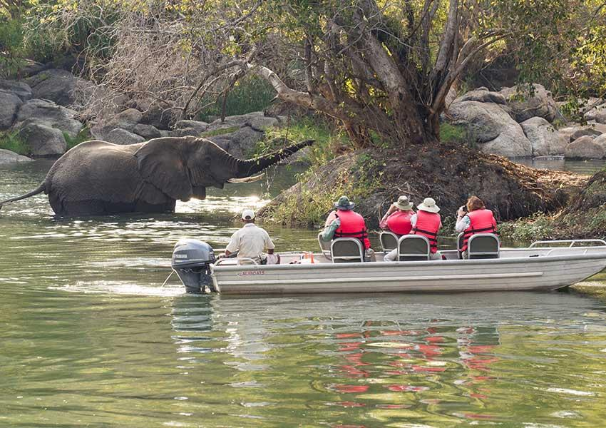 Visitors exploring the natural surroundings near Chingola, Zambia, with scenic views along the Kafue River.