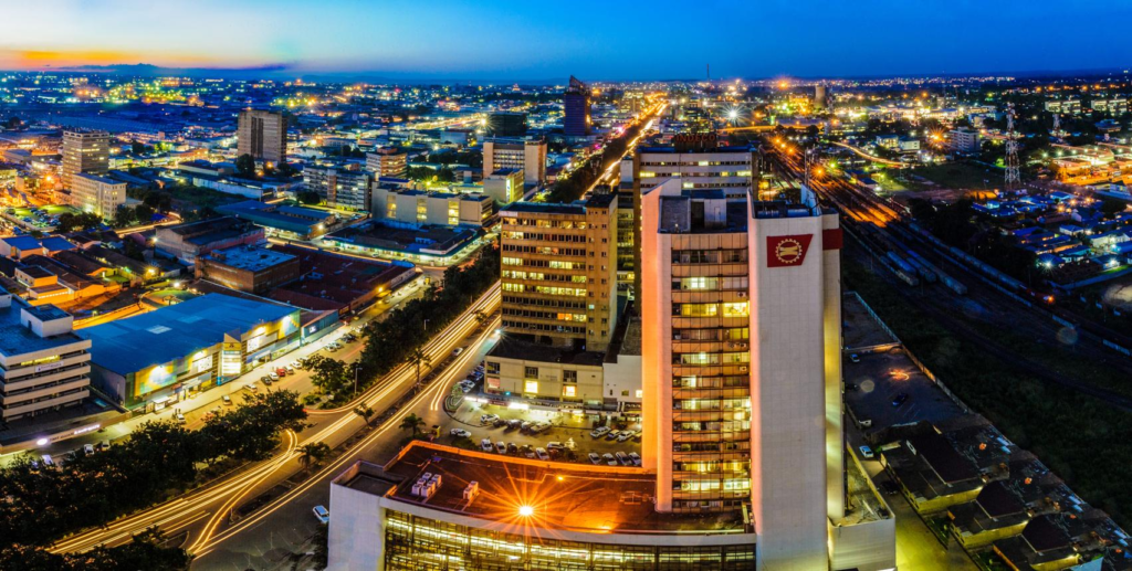 A panoramic aerial view of Lusaka showing the cityscape, skyline, and surrounding urban landscape in Zambia.