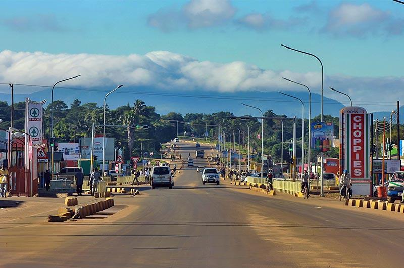 Visitors walking through streets in Chipata with local markets, shops, and pedestrian activity.
