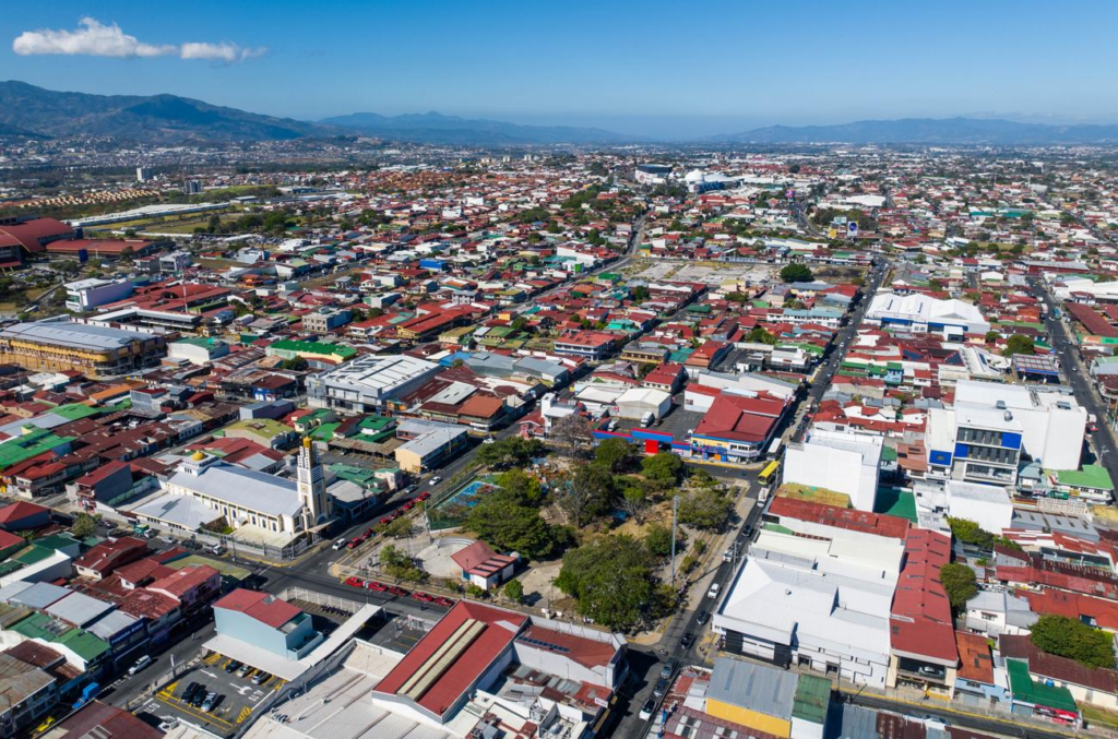 A panoramic aerial view of Heredia showing the cityscape, urban areas, and surrounding landscapes in Heredia Province, Costa Rica.