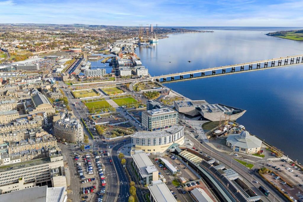 A panoramic aerial view of Dundee showing the cityscape, waterfront, and River Tay in Scotland, UK.