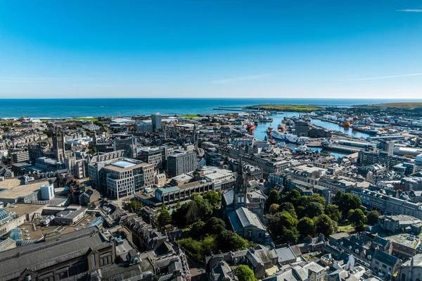 A panoramic aerial view of Aberdeen showing the cityscape, North Sea coastline, and urban layout in Scotland, UK.