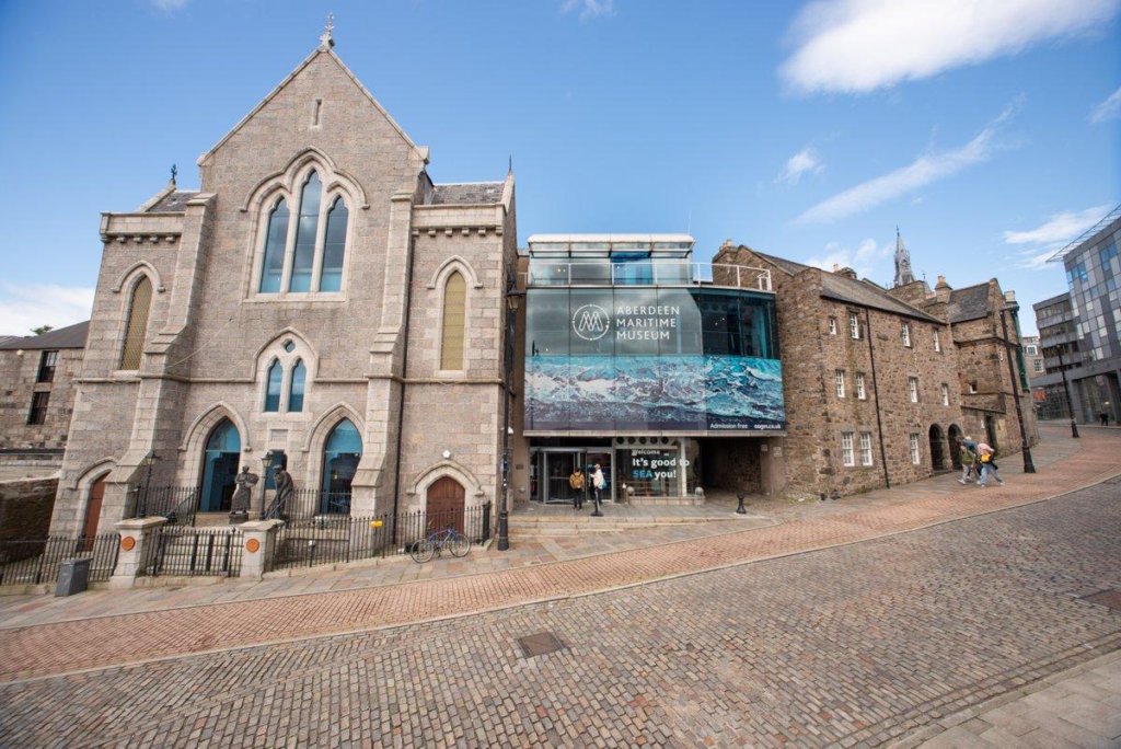 Visitors exploring the Aberdeen Maritime Museum in Scotland, showcasing maritime history and cultural exhibits.
