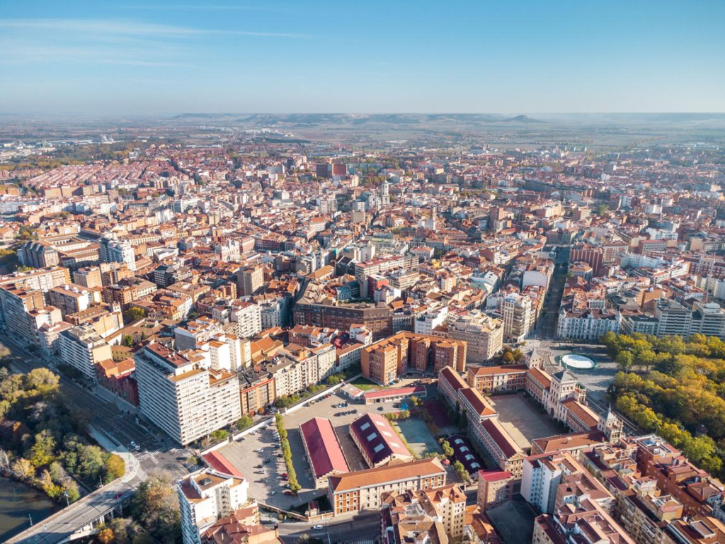 A panoramic aerial view of Valladolid showing the cityscape, historic center, and surrounding urban areas in Spain.