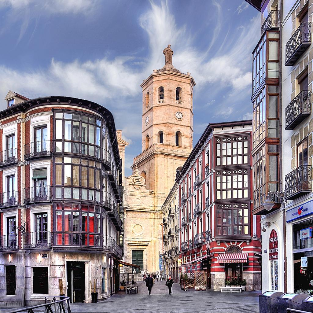 Visitors walking through streets in Valladolid with local shops, cafés, and pedestrian activity in the historic center.