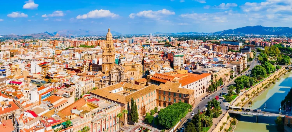 A panoramic aerial view of Murcia showing the cityscape, historic center, and the Cathedral of Murcia in Spain.