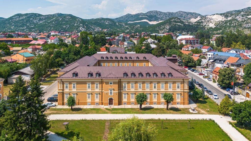 Visitors exploring the National Museum of Montenegro in Cetinje, a historic and cultural landmark.