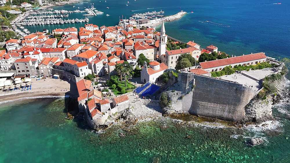 Visitors exploring the Budva Citadel in Montenegro, a historic fortress overlooking the Adriatic Sea.