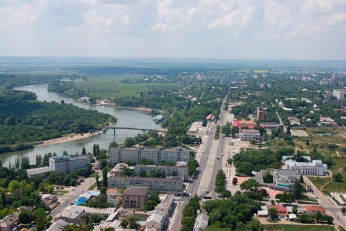 A panoramic aerial view of Tiraspol showing the cityscape, urban layout, and the Dniester River in Moldova.