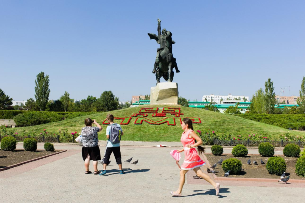 Visitors viewing the Suvorov Monument in Tiraspol, Moldova, a historic landmark commemorating Alexander Suvorov.