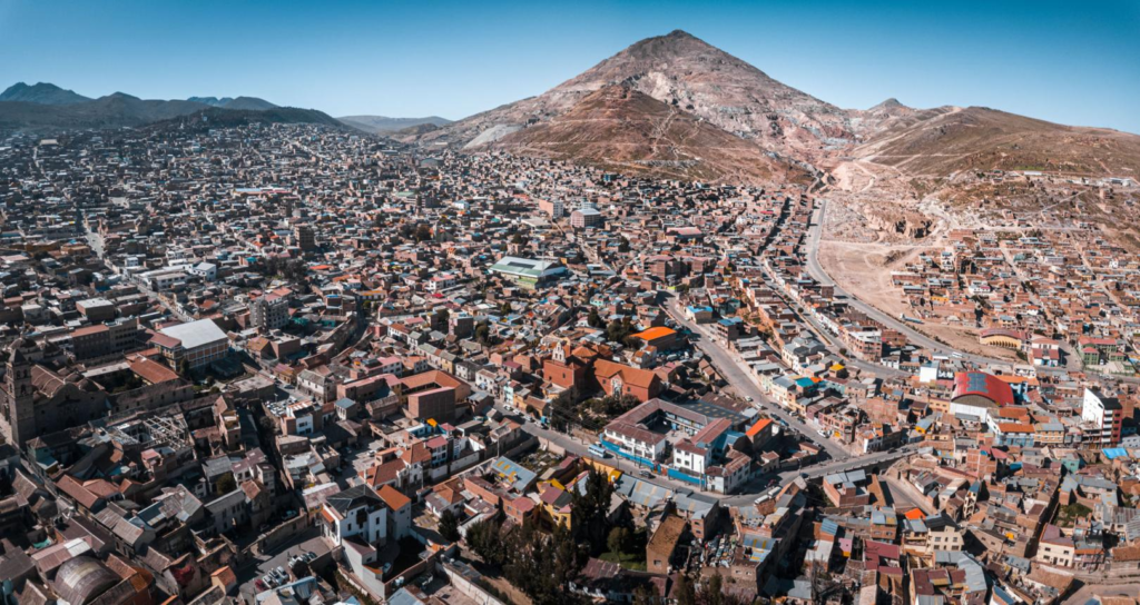 A panoramic aerial view of Potosí showing the cityscape and the Cerro Rico mountain in Bolivia