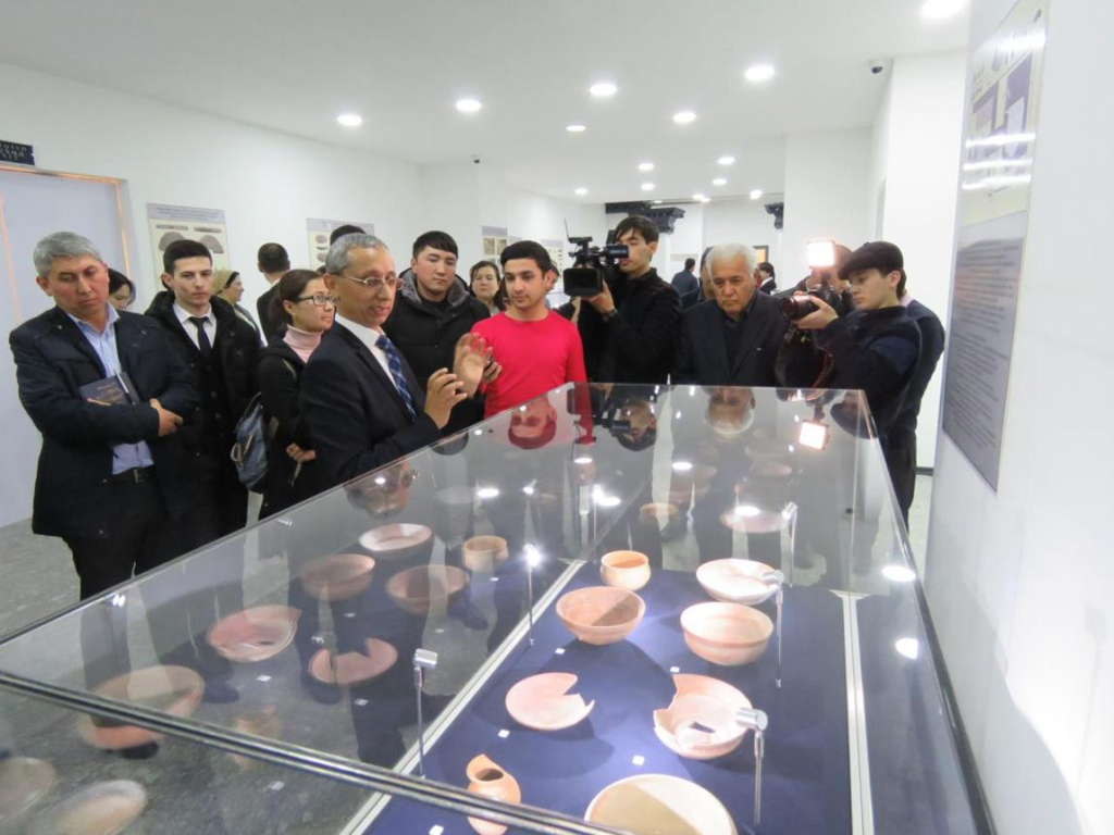 Visitors exploring the Fergana Regional Museum in Uzbekistan, a cultural and historical landmark.