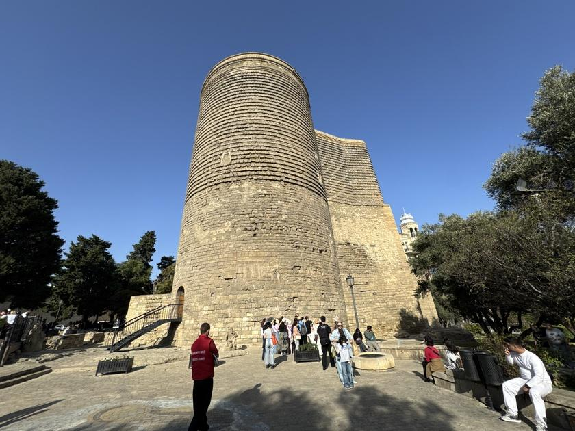 Visitors exploring the Maiden Tower in Baku, Azerbaijan, a historic landmark in the old town
