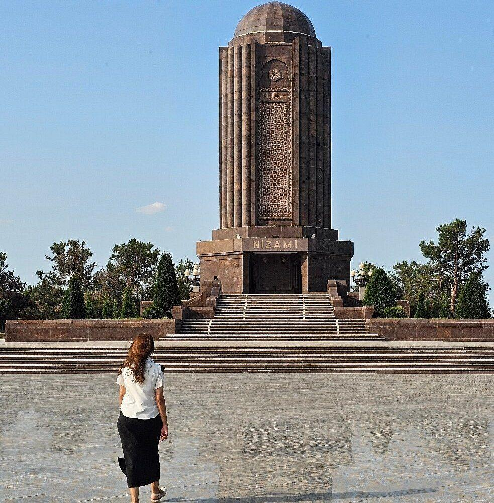 Visitors exploring the Nizami Mausoleum in Ganja, Azerbaijan, a historic landmark honoring the poet Nizami Ganjavi.