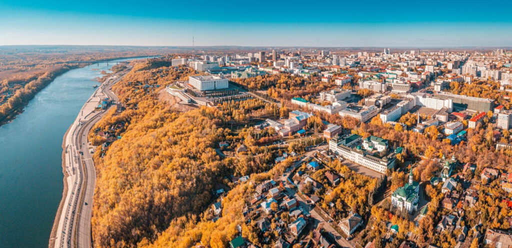 A panoramic aerial view of Ufa showing the cityscape and the Belaya River embankment in Russia