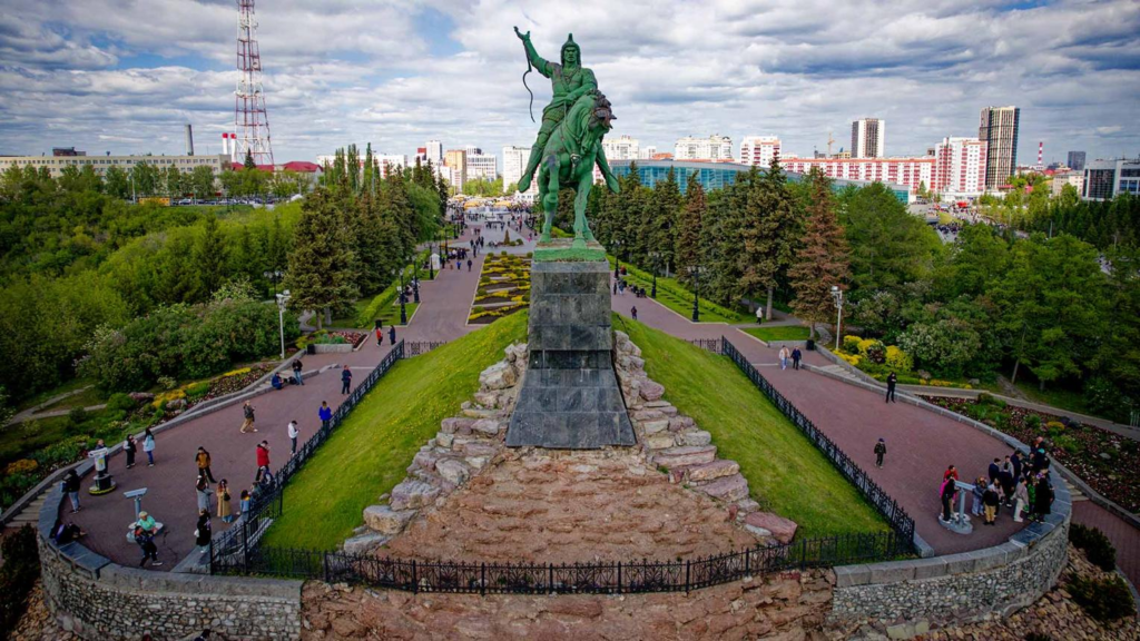 Visitors exploring the Salavat Yulaev Monument in Ufa, Russia, a historic landmark.