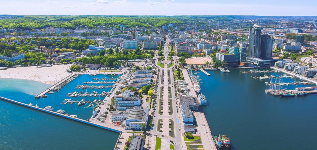 An aerial view of Gdynia showing the city skyline and Baltic Sea port.