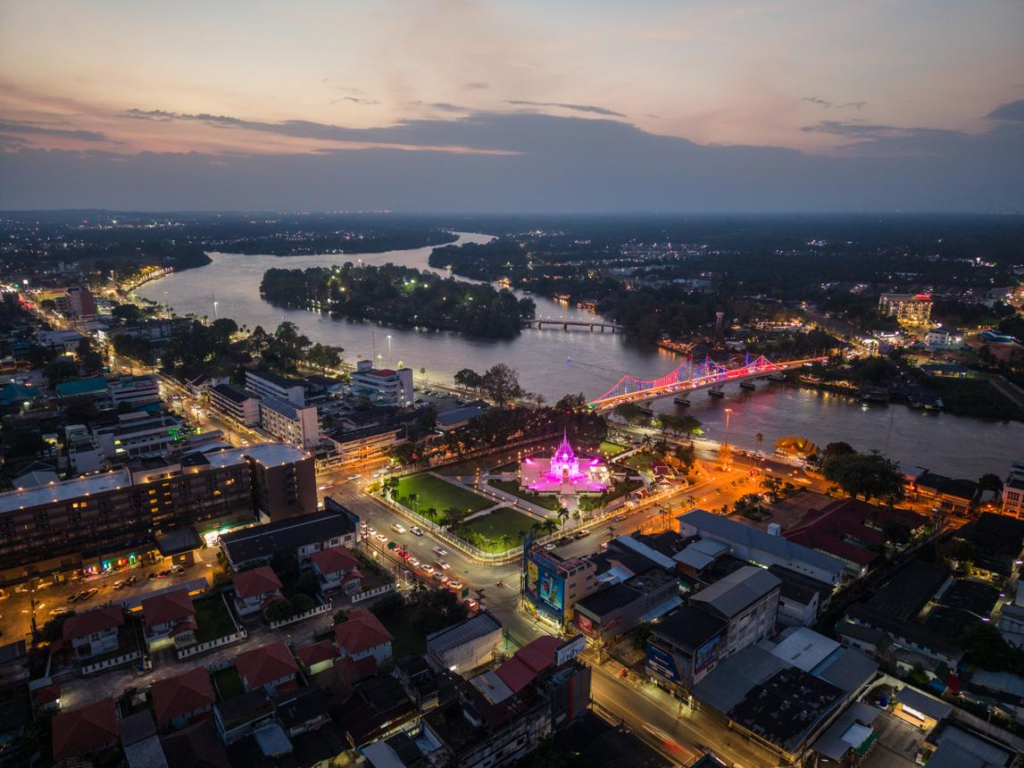 A panoramic aerial view of Surat Thani showing the cityscape and the Tapi River in Thailand.