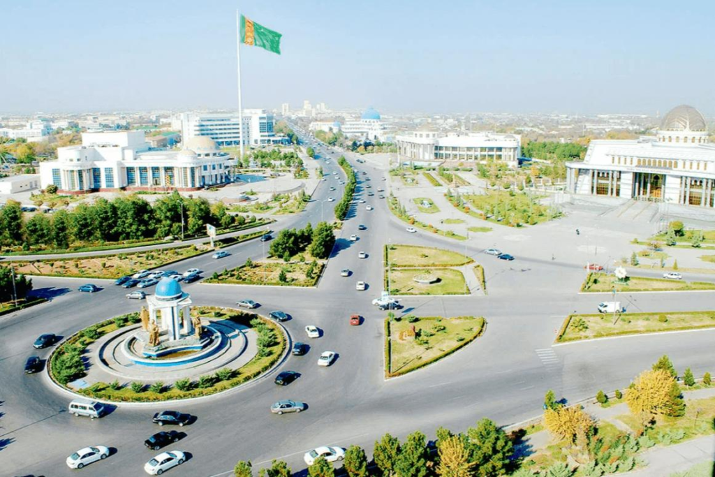 A panoramic aerial view of Dashoguz showing the cityscape and surrounding desert areas in Turkmenistan.