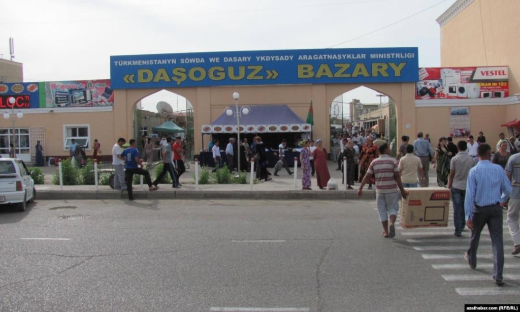 Visitors walking through streets in Dashoguz with local shops, markets, and pedestrian activity.